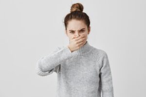 young woman with halitosis