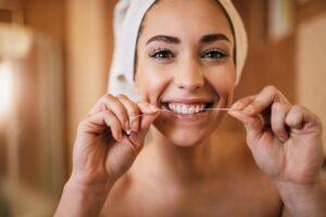 woman flossing